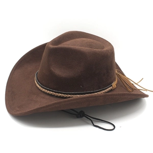 Detail of dark brown suede cowboy hat featuring woven band and adjustable windproof strap