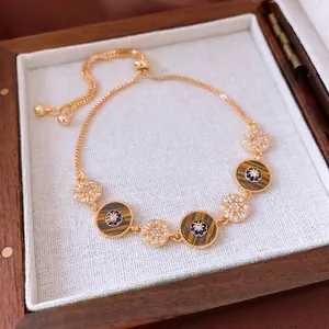 French retro 18k gold plated bracelet with starburst round discs and blue zircon