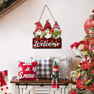 Christmas wooden welcome sign featuring three festive gnomes with holiday tree background
