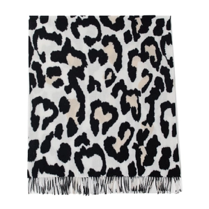 Soft faux cashmere scarf with black and white cow print and tassel fringe details