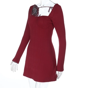 Close-up of wine red knitted mini dress showing square neck and ruched chest detail