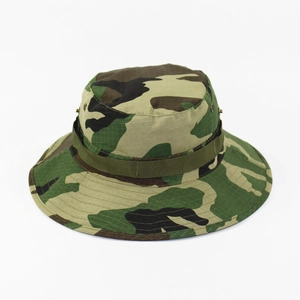 Detail view of camouflage boonie hat featuring metal eyelets and durable webbing band