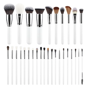 28-piece professional makeup brush set with white handles and silver ferrules on white background