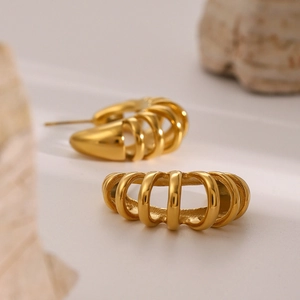 Detailed macro view of 18k gold plated stainless steel hollow cage hoop earrings