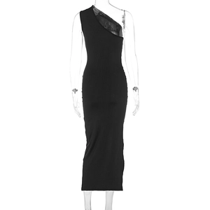Detail of black one-shoulder dress showing sheer mesh sleeve and slim fit back design