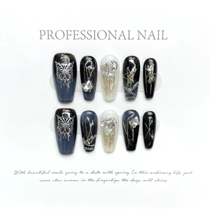 Handmade press-on nails featuring 3D butterfly, silver chains, and rhinestones in punk style