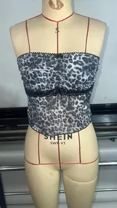 Detailed view of leopard print camisole featuring black lace trim and slim fit design