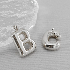 Chubby bubble style stainless steel letter B and C pendants in silver finish