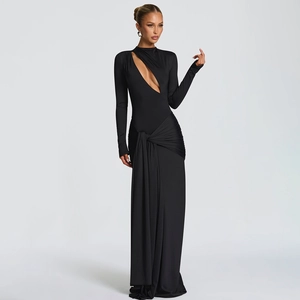 Detail view of the black evening dress showing asymmetrical cutout and elastic fabric texture