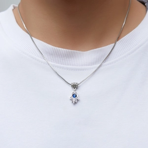 Silver Fatima Hand necklace with blue evil eye pendant on a box chain for women