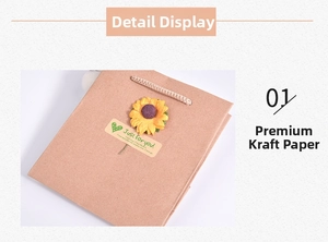 Detail of brown kraft paper gift bag with sunflower decor and woven handles