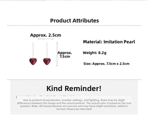 Detail view of red heart drop earrings showing 8.2g weight and 7.5cm size dimensions