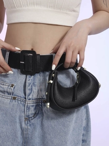 Elegant black textured leather crescent bag with metal buckle and matching belt