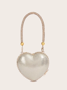 Elegant heart-shaped evening bag with a shimmering silver finish and rhinestone handle