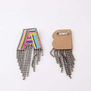 Colorful woven letter A brooch with sparkling rhinestone tassels and safety pin back