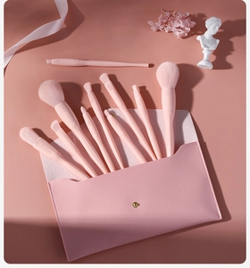 Pink makeup brush set with 10 pieces in a matching snap button pouch with soft bristles