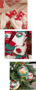 Christmas coral fleece socks inside clear ornament balls on festive tree