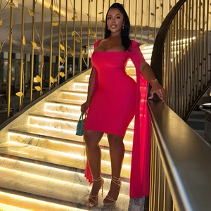 Detail of rose red off-shoulder mini dress with dramatic floor-length split sleeves