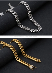 Detailed close-up of silver and gold stainless steel Cuban chains with rhinestone buckle