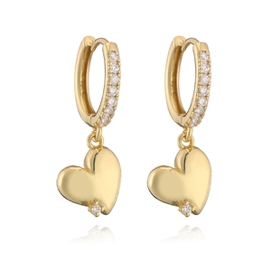 Detail of heart dangle earrings in gold with pavé cubic zirconia on the hoops