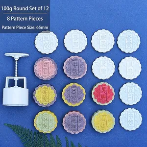 Detail of 100g round mooncake press mold set with multiple floral and text patterns