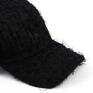 Black frayed denim baseball cap with wide brim for sun protection and face slimming
