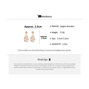 Detail view of retro oval drop earrings with multi-color zircon inlay and copper finish