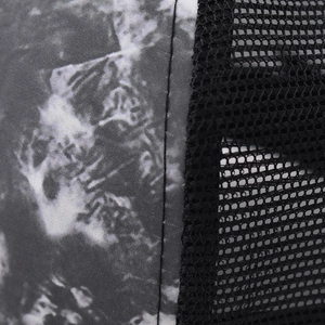 Detailed close-up showing printed fabric stitching and black breathable mesh on baseball cap