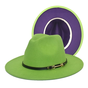Detail of neon green fedora hat showing deep purple lining and black leather band buckle