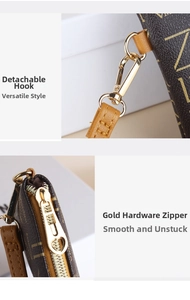 Detail shot of the detachable golden metal hook and zip on the brown leather crossbody bag
