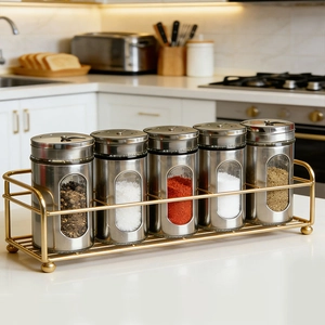 Stainless steel seasoning jars set with glass window and golden metal storage rack