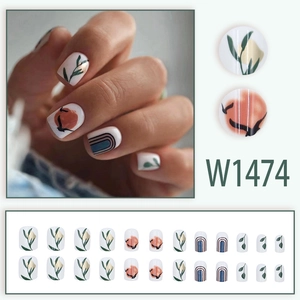 Press-on nail set with white base, watercolor leaves and orange pattern details