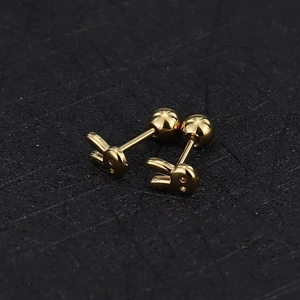 Detailed close-up of golden rabbit stud earrings with secure ball screw back closure