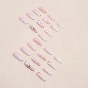 Long ballerina press-on nails featuring white gradient, 3D floral accents and pink rhinestones