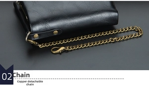 Detail of vintage copper chain on black leather wallet with detachable function