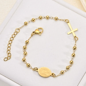 Gold stainless steel beaded bracelet featuring Virgin Mary medal and cross on white box
