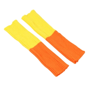 Detailed texture of knitted leg warmers in vibrant orange and yellow striped color block