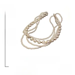 Detail view of multi-layer pearl necklace showing 19.9g weight and 47.5cm length measurements