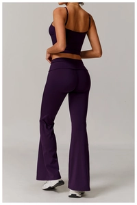 Rear view of purple yoga set featuring slim strap top and high-waisted flared leggings