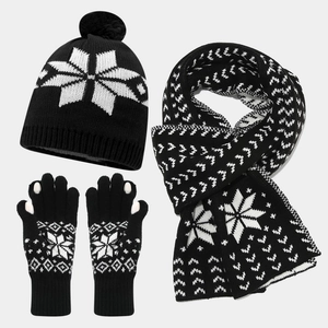 Winter knitted set with snowflake patterns including a pom-pom hat, scarf, and gloves
