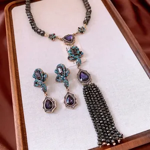 Vintage jewelry set with teardrop pendants, tassel necklace and matching earrings