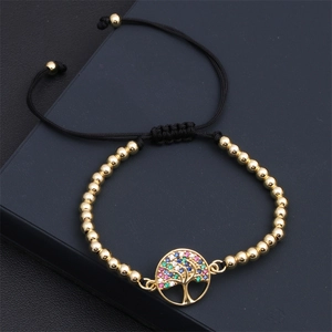 Close-up of adjustable Tree of Life bracelet with colorful cubic zirconia and gold beads