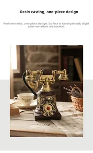 Detail of vintage rotary telephone model made of resin on a rustic wooden table setup