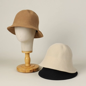 Minimalist knitted bucket hat for women in camel, beige and black colors with woven texture