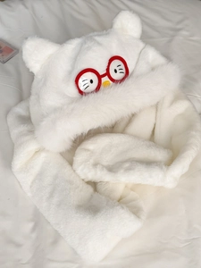 Detail of plush white cat hooded scarf with red glasses and 3D ears texture