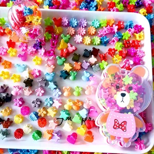 Colorful mini hair claws in star, flower, and animal shapes with bear storage case