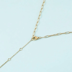 Close-up of 14K gold plated paperclip chain necklace with lobster clasp and extender