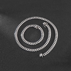 8mm silver stainless steel Cuban chain necklace and bracelet set on black background