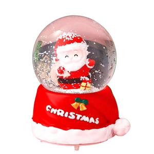 Christmas snow globe with Santa Claus and festive red base featuring white lettering