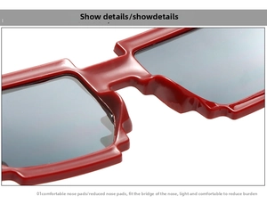 Detail of red pixelated mosaic sunglasses frame showing ergonomic nose pads and step design